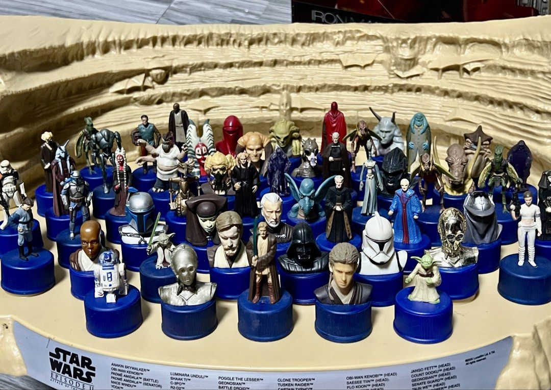 Star Wars Episode II Pepsi Bottle Cap Figures Display (Category: Vintage Collectibles) located in Manila. Submitted by thegreyhousemarket (Listing ID 1440165632, Image 2). Description: - Complete set of Star Wars Episode II Pepsi bottle cap figures. - Features characters from the movie. - Comes with a desert-themed display stand. - Includes a variety of character figures and busts. - A must-have collectible for Star Wars fans..