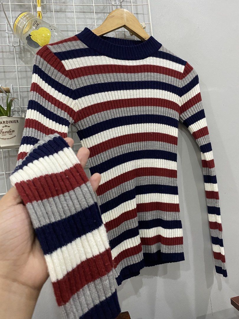 Striped Ribbed Mock Neck Long Sleeve Sweater (Category: Longsleeves) located in Kalibo. Submitted by bonsaiclo (Listing ID 1440063992, Image 2). Description: - Ribbed long-sleeve sweater - Mock neckline - Classic horizontal stripe pattern - Available colors: Navy blue, Burgundy, Grey, White - Fitted style - Perfect for layering or wearing alone - Versatile wardrobe addition.