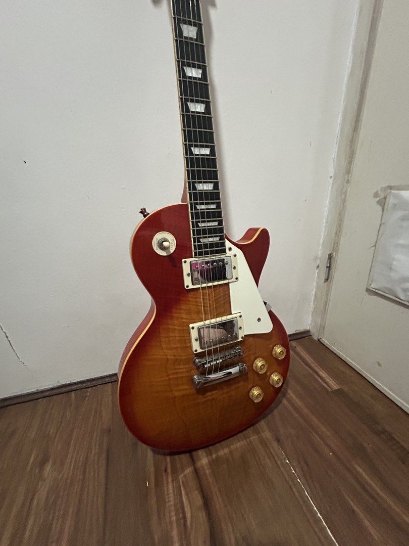 Thomson Les Paul v-series (Category: Musical Instruments) located in Quezon City. Submitted by pia_adela.secreto (Listing ID 1440188924, Image 3). Description: Thomson Les Paul V-Series cherry sunburst barely used -inclusions are bag, cable, strap, and fretwrap. -no hidden issue -stock strings issue: last pic, nagpeel yung sa may head pero ‘di naman halata - the asking price is ₱9,800 though i am open for negotiations location is ncr/quezon city 