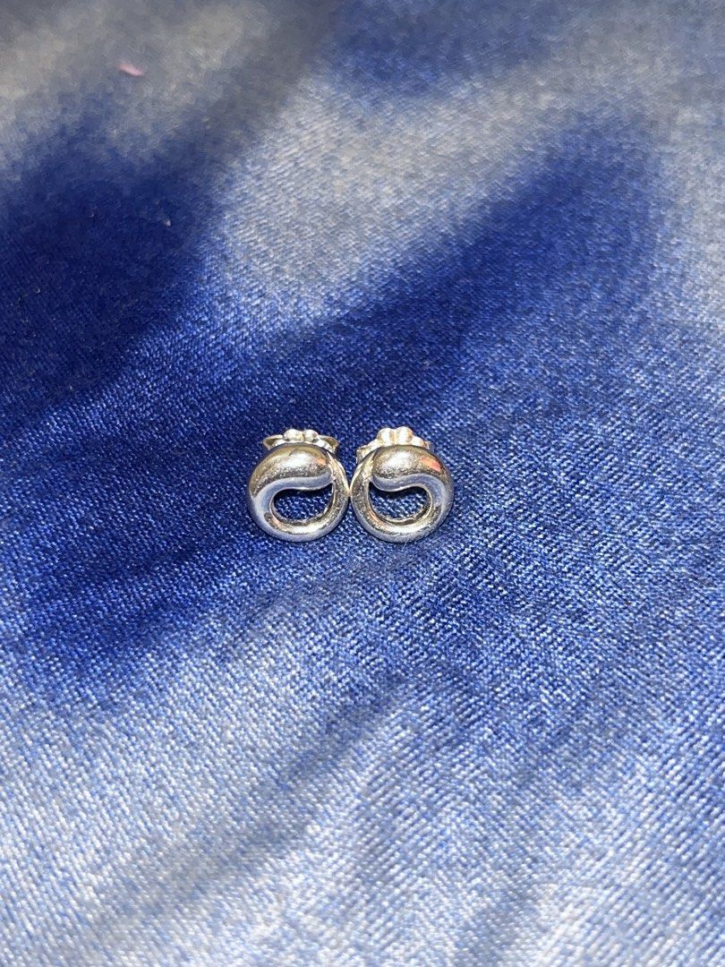 Tiffany & Co. Sterling Silver Earrings (Category: Earrings) located in Tagudin. Submitted by aljaneaddtoukart (Listing ID 1440060127, Image 2). Description: - Authentic Tiffany & Co. sterling silver earrings - Classic circular design with a subtle twist - Ideal for everyday wear or adding sophistication - Comes with original earring backs.