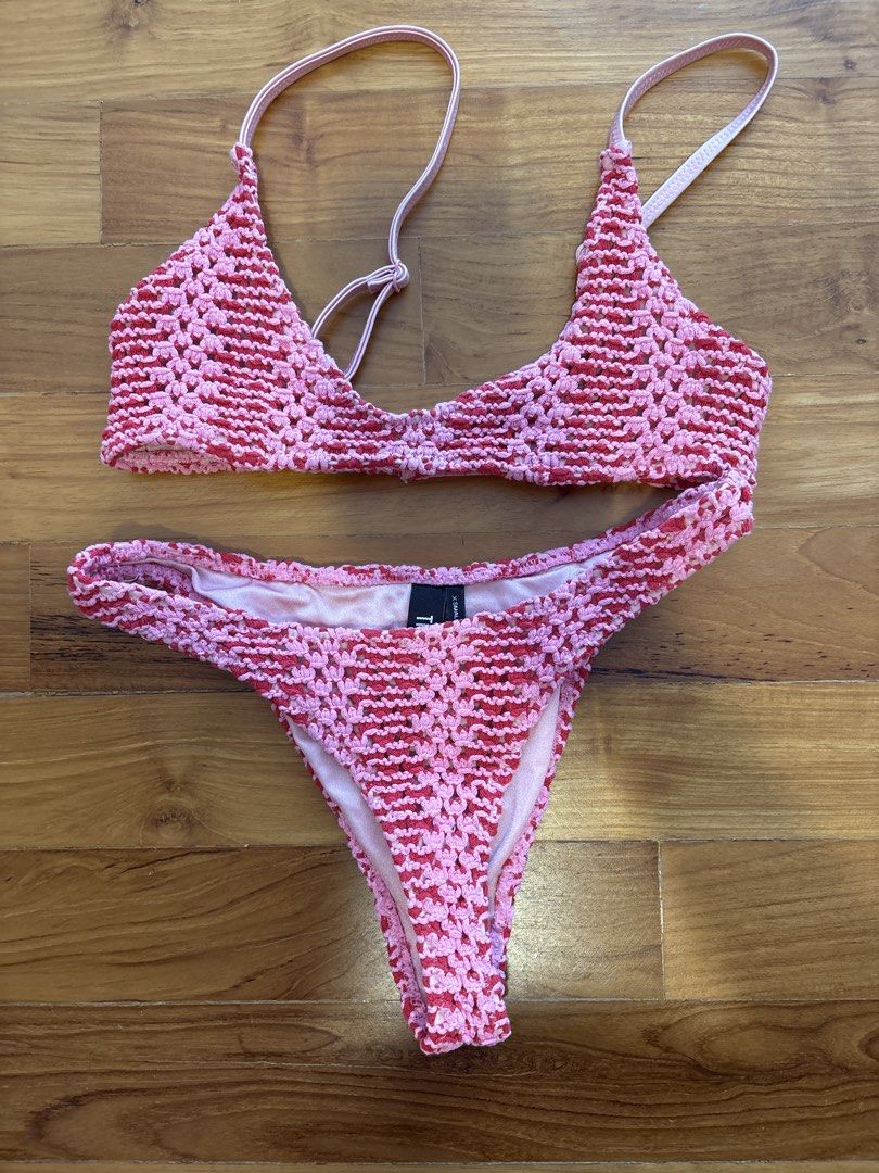 TRIANGL Crochet Bikini Set - Pink & Red (Category: Bikinis & Swimsuits) located in Singapore. Submitted by lou______ (Listing ID 1440026271, Image 1). Description: - Cute crochet bikini set from TRIANGL - Textured pink and red pattern - Top: Size Small - Bottoms: Size X-Small - Ideal for beach vacations or pool days.