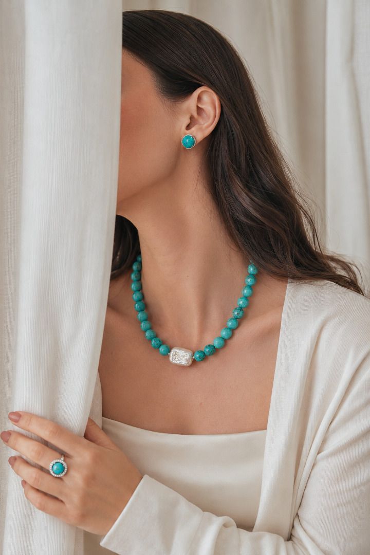 Turquoise Grandeur Necklace (Category: Necklaces) located in Valenzuela. Submitted by ivorycreations (Listing ID 1440195448, Image 1). Description: - Beautiful turquoise necklace with a unique silver-toned clasp. (P3999) - Matching turquoise stud earrings. (P1150) - Statement ring featuring a turquoise stone surrounded by small clear stones. (P1350) - Ideal for gifting or personal indulgence..