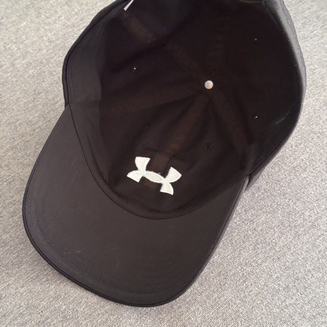 UNDER ARMOUR Black Cap (Category: Caps & Hats) located in Quezon City. Submitted by marketbuenaobra (Listing ID 1440017162, Image 3). Description: - Guaranteed Authentic. Bought it from the store. - Once used. Almost new - RFS: Decluttering.