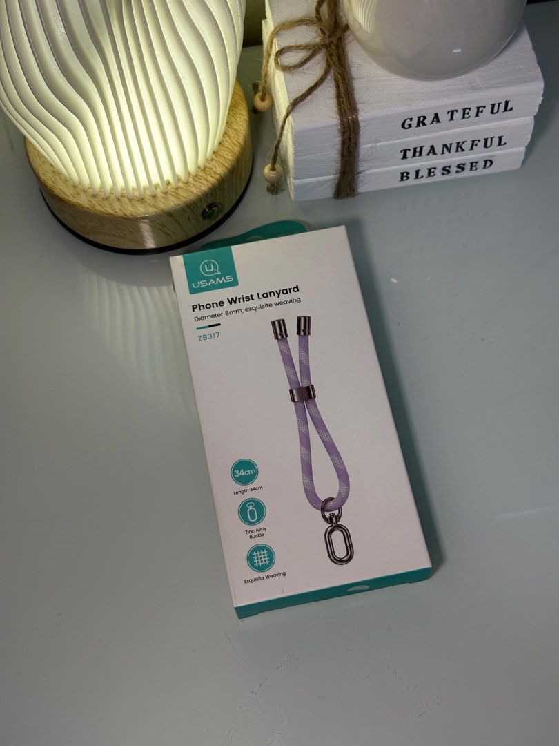USAMS Phone Wrist Lanyard (Category: Other Mobile & Gadget Accessories) located in Quezon City. Submitted by etceterass (Listing ID 1440137923, Image 1). Description: Bnew sealed.