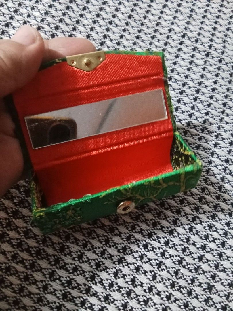 Vintage #mbroidered Lipstick Case with Mirror (Category: Mirrors) located in Bocaue. Submitted by marajapansurplus (Listing ID 1440008633, Image 1). Description: - Vintage compact mirror case - Intricate green embroidery with floral accents - Red satin interior lining - Includes a small mirror - Secure clasp closure - Perfect for stylishly carrying essentials.