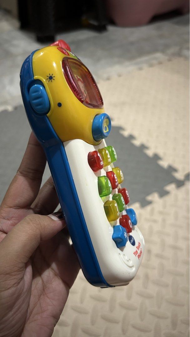 VTech Tiny Touch Phone Toy (Category: Toys & Games) located in Quezon City. Submitted by amaripreloved (Listing ID 1440112110, Image 3). Description: - VTech Tiny Touch Phone toy - Designed for toddlers - Features colorful, pressable number buttons - Includes letters and shapes on buttons - Playful characters on the screen - Fun and interactive play Good working condition 📍nova qc 💰gcash bank 📦 jnt lala.