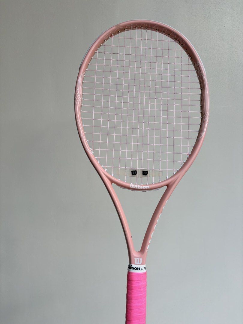 Wilson Pink Intrigue Tennis Racket (Category: Racket and Ball Sports) located in Quezon City. Submitted by yannyy001 (Listing ID 1440172553, Image 2). Description: -Grip 2 -With new pink Wilson Revolve Spin strings -Perfect for Beginners -Bought last October 2025 from Wilsong Shang .