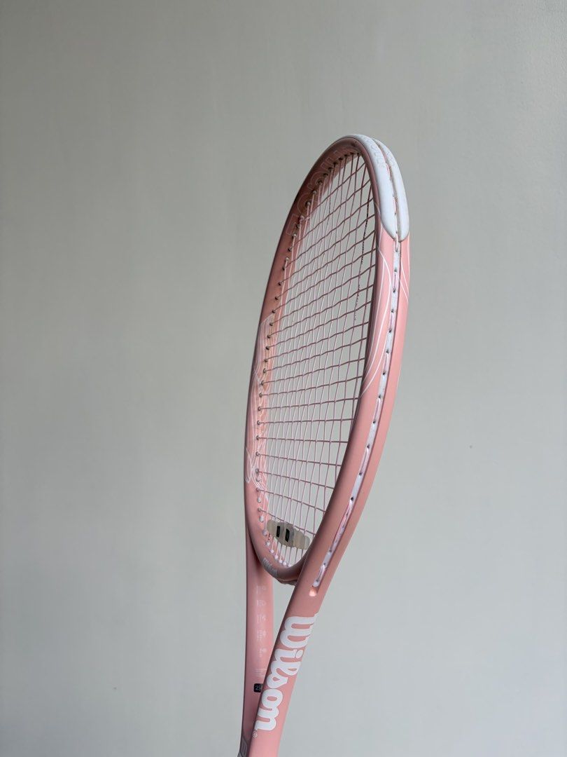 Wilson Pink Intrigue Tennis Racket (Category: Racket and Ball Sports) located in Quezon City. Submitted by yannyy001 (Listing ID 1440172553, Image 3). Description: -Grip 2 -With new pink Wilson Revolve Spin strings -Perfect for Beginners -Bought last October 2025 from Wilsong Shang .