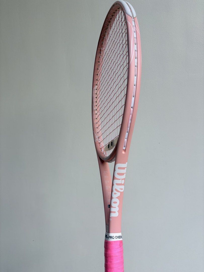 Wilson Pink Intrigue Tennis Racket (Category: Racket and Ball Sports) located in Quezon City. Submitted by yannyy001 (Listing ID 1440172553, Image 1). Description: -Grip 2 -With new pink Wilson Revolve Spin strings -Perfect for Beginners -Bought last October 2025 from Wilsong Shang .