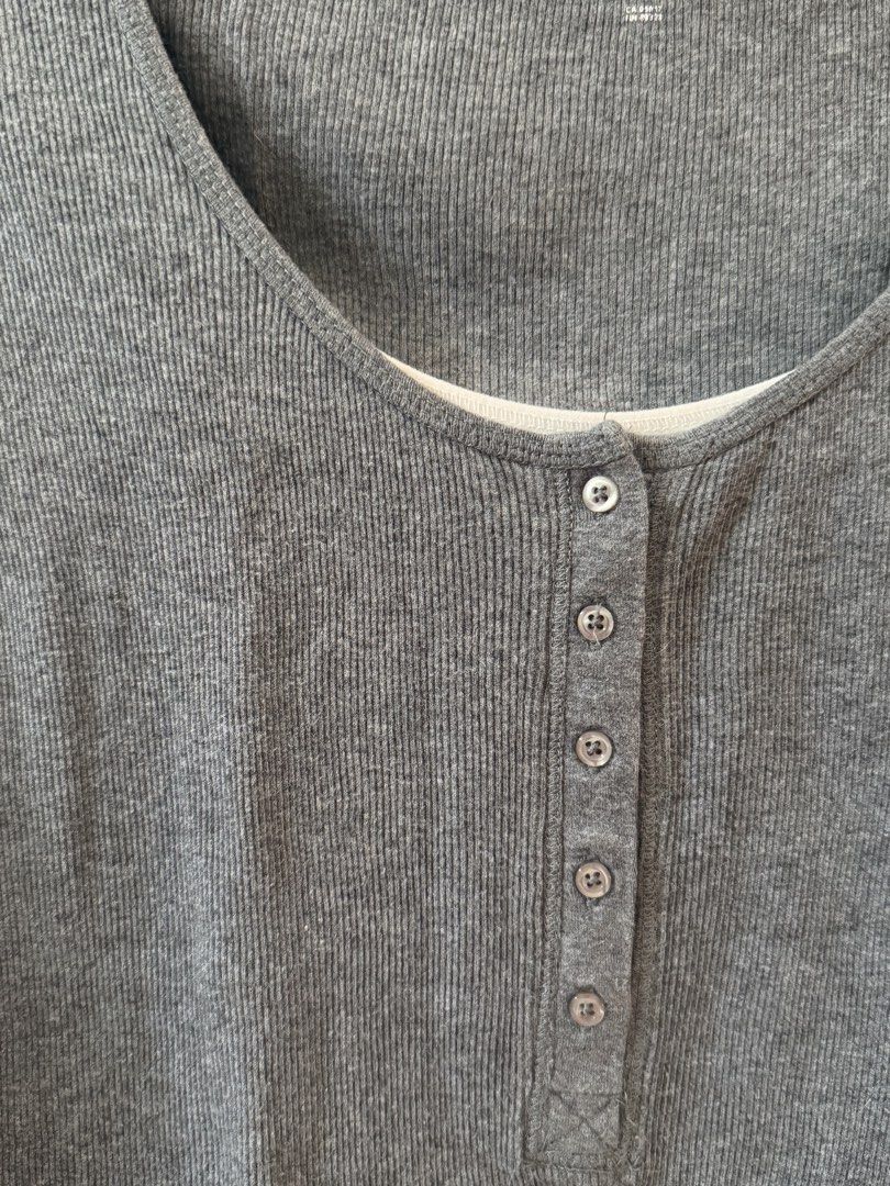 Y2K Grey Henley Shirt (Category: Longsleeves) located in Manila. Submitted by twicetold (Listing ID 1440051127, Image 2). Description: - from Canada - Features: Front kangaroo pocket, layered look with white hem - Material: 100% Cotton - super nice! fits S-L (stretchable, comfortable cloth).