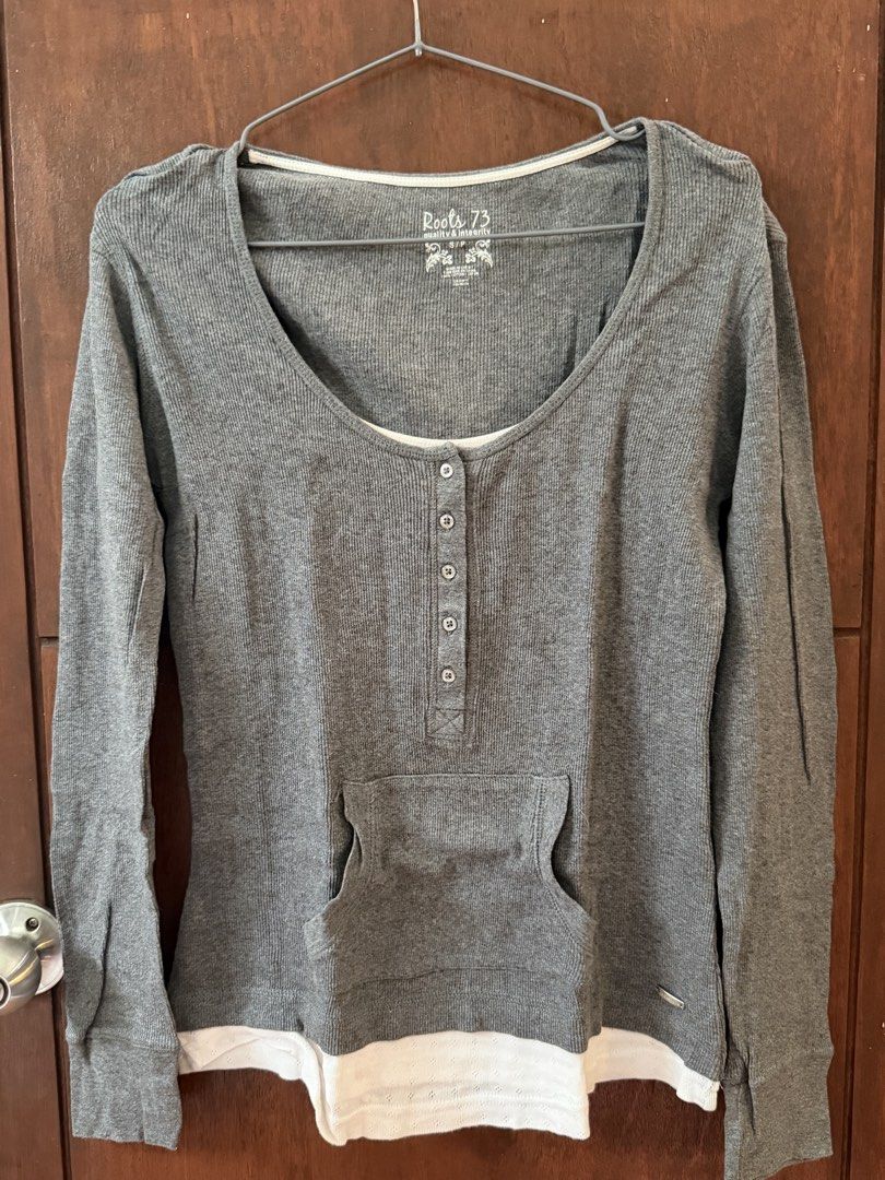 Y2K Grey Henley Shirt (Category: Longsleeves) located in Manila. Submitted by twicetold (Listing ID 1440051127, Image 1). Description: - from Canada - Features: Front kangaroo pocket, layered look with white hem - Material: 100% Cotton - super nice! fits S-L (stretchable, comfortable cloth).