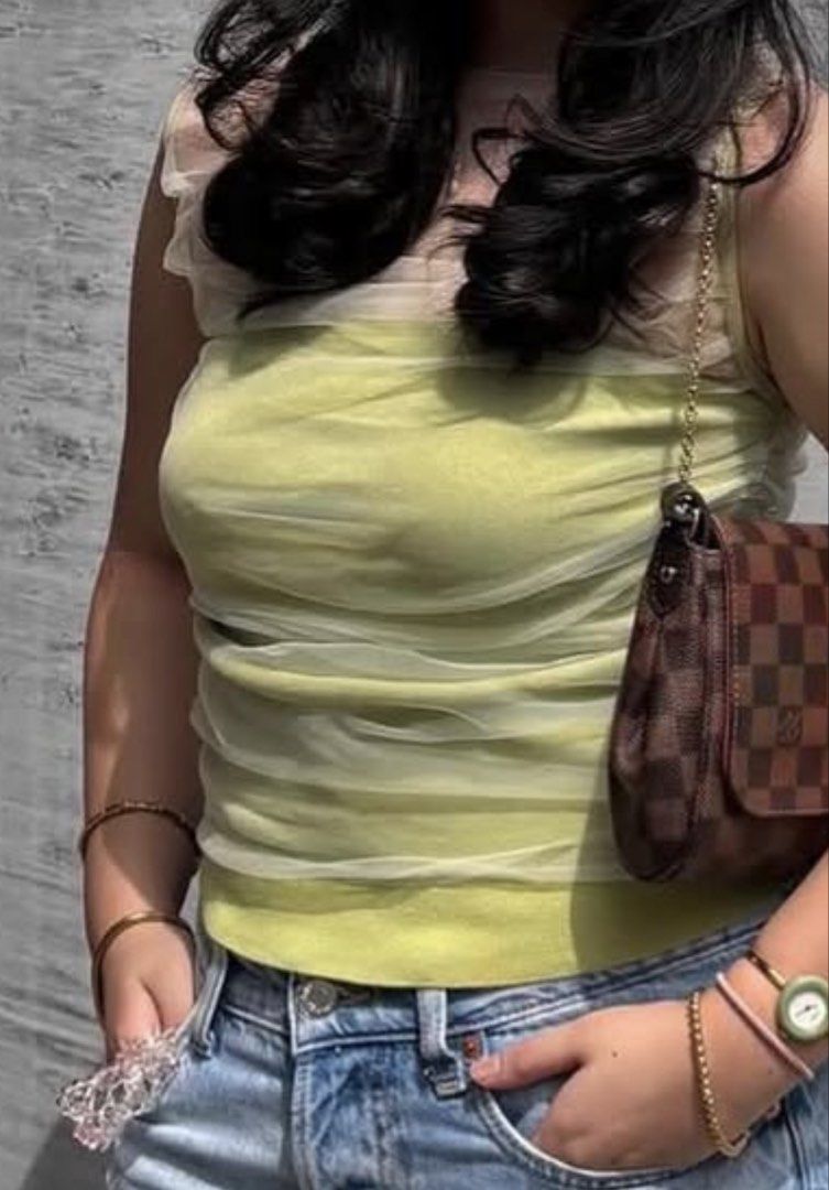 Zara Ruched Mesh Overlay Top Lime Green (Category: Blouses) located in Quezon City. Submitted by sophabsells (Listing ID 1440175384, Image 1). Description: - Stylish Zara top in lime green - Features a ruched mesh overlay for texture - Sleeveless design - Flattering fit - Versatile for casual or dressed-up looks.