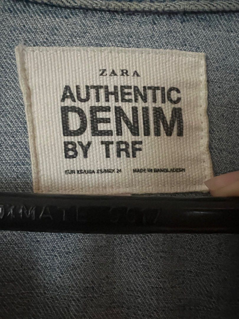 ZARA TRF denim jacket (Category: Coats, Jackets and Outerwear) located in Pasig City. Submitted by tiny_studios (Listing ID 1440184647, Image 2). Description: - Zara Authentic denim - Oversize fit - shoulder 60cm - sleeves 54cm - length 54cm - chest 56cm - model usually wears xs - very thick and sturdy denim - buttons still very shiny.