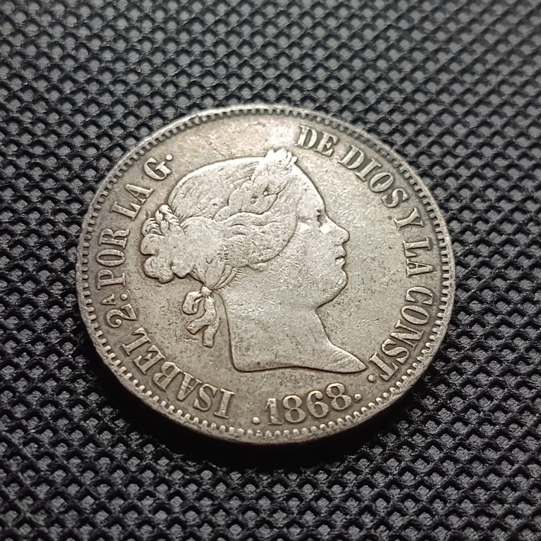 1868 Spain 50 Centimos Silver Coin Isabel II (Category: Currency) located in Quezon City. Submitted by Coiners (Listing ID 1440384538, Image 1). Description: - Vintage 1868 Spanish 50 centimos coin - Features Queen Isabel II on one side - Spanish coat of arms on the other side - Made of silver - Ideal for coin collectors.