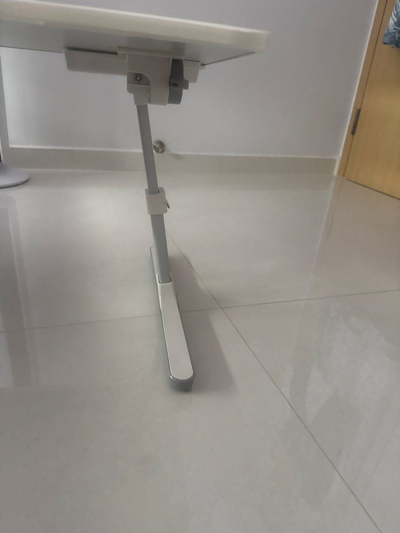 Adjustable Height Bedside Table (Category: Tables & Sets) located in Singapore. Submitted by kath6988 (Listing ID 1440243763, Image 2). Description: - White bedside table - Adjustable height metal legs - Flat tabletop with 2 side slots - Simple and functional design - Ideal for bedside or sofa use.