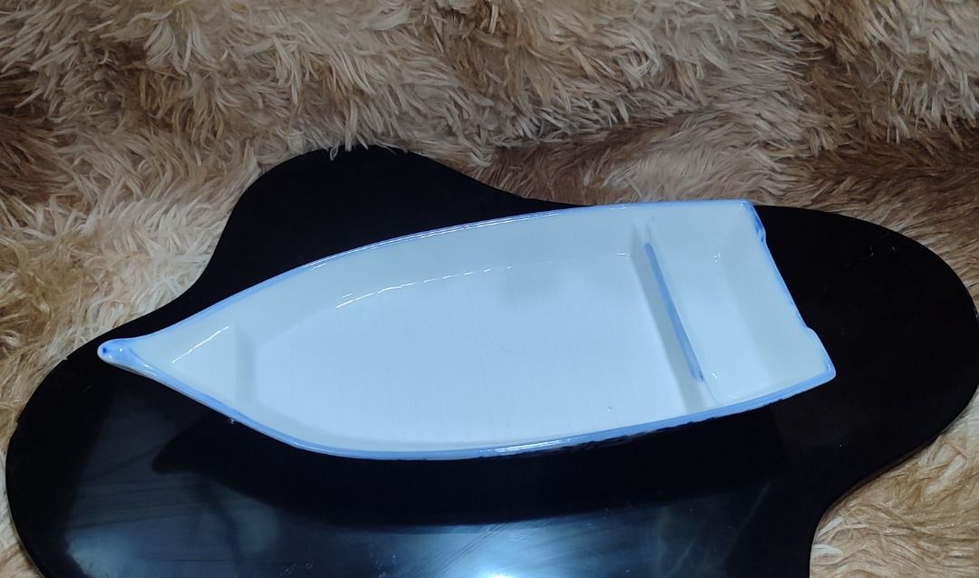 Arita White Ceramic Serving Platter with Blue Bamboo Design (Category: Dinnerware & Cutlery) located in Makati City. Submitted by sassymaja (Listing ID 1440236580, Image 1). Description: - Elegant white ceramic serving platter - Features a delicate blue bamboo pattern along the edge - Unique shape, ideal for appetizers, sushi, or desserts - Adds a touch of sophistication to any table setting -Perfect for sushi or siomai serving platter.