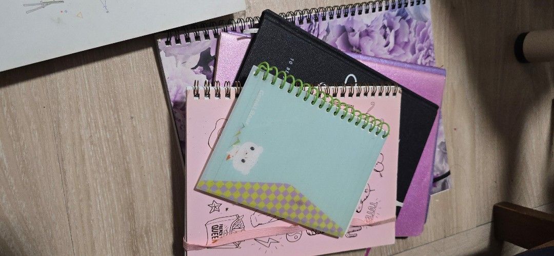 Assorted notebooks (Category: Stationery & School Supplies) located in Singapore. Submitted by riuslei (Listing ID 1440342137, Image 6). Description: total 7 notebooks im decluttering my room and found alot of notebooks that were empty take a few or take all, its up to you.