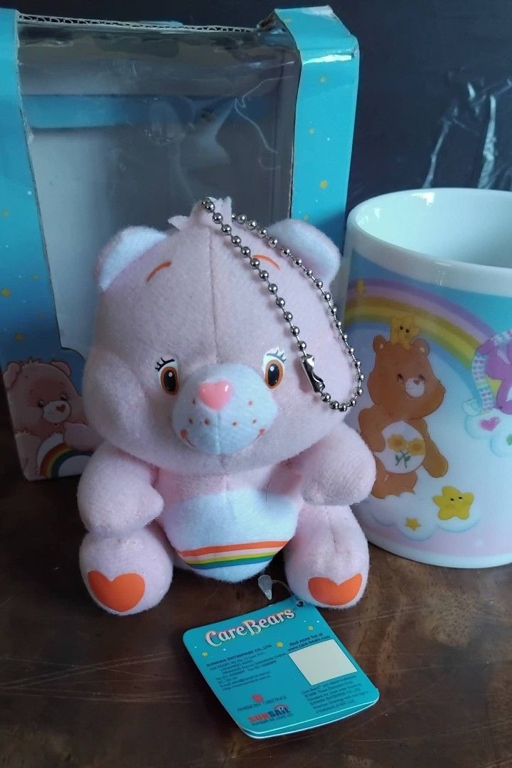 AUTHENTIC CARE BEARS CHEER BEAR MUG WITH MATCHING KEYCHAIN PLUSH (SURPLUS) (Category: Plushies & Soft Toys) located in Cavite. Submitted by jiearah.online.shop (Listing ID 1440211000, Image 2). Description: AUTHENTIC CARE BEARS CHEER BEAR MUG WITH MATCHING KEYCHAIN PLUSH (PRELOVED / SURPLUS) Item from our Japan Surplus Supplier. Selling as is. ACTUAL ITEM ON PHOTO. Minimal Signs of Usage. Flaw : Slightly Damaged Box Mug Approximately 3.5 inches. 