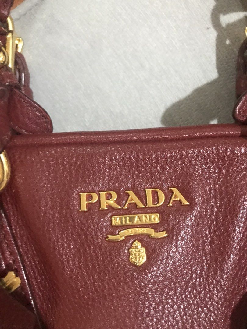 Authentic Prada Red Leather Bag bought from Prada (Category: Luxury Bags & Wallets) located in Quezon City. Submitted by katie8michelle (Listing ID 1440331970, Image 3). Description: Great condition, bought in a Prada store in New York. Rarely used because i prefer small sling bags. Actual bag is in great condition, but dust bag has loose thread. Negotiable. .