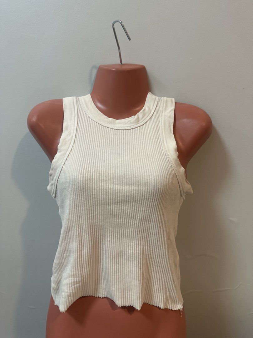 Black and White Ribbed Tank Tops (Category: Sleeveless) located in Las Pinas. Submitted by Mkdot (Listing ID 1440266633, Image 3). Description: - Basic black ribbed tank top - Racerback style - Raw hem detail - Stretchy material - Easy to pair with anything - Great for layering or wearing on its own.