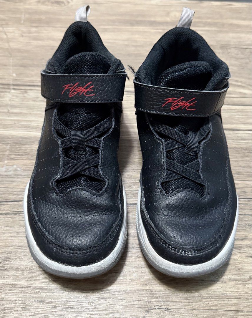 Black Jordan Flight Sneakers with Red Accent (Category: Babies & Kids Fashion) located in Taytay. Submitted by shopbye (Listing ID 1440339024, Image 1). Description: - Black high-top Jordan for kids - Features a velcro strap with red 'Flight' text - Lace-up front for a secure fit - Perforated details on the toe box for breathability - Durable white sole - Ideal for everyday wear and active play.