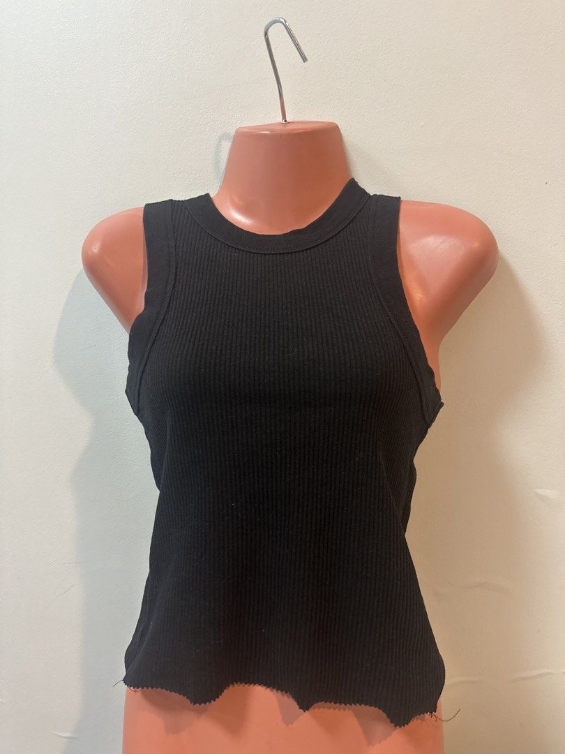 Black and White Ribbed Tank Tops (Category: Sleeveless) located in Las Pinas. Submitted by Mkdot (Listing ID 1440266633, Image 1). Description: - Basic black ribbed tank top - Racerback style - Raw hem detail - Stretchy material - Easy to pair with anything - Great for layering or wearing on its own.