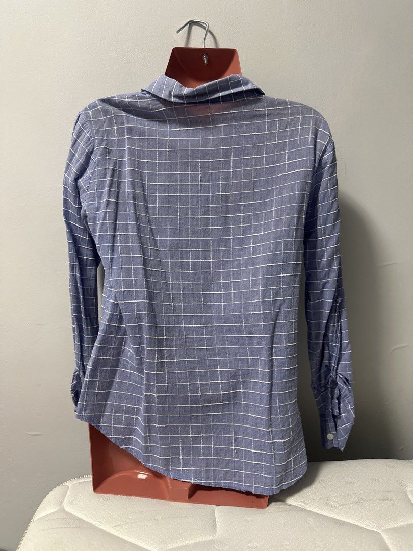Blue and white checkered long-sleeve button-up shirt (Category: Longsleeves) located in Las Pinas. Submitted by Mkdot (Listing ID 1440315846, Image 2). Description: - Classic blue and white checkered pattern - Long sleeves with button cuffs - Single left chest pocket - Button-up front closure - Versatile for casual wear or layering - Pairs well with jeans or shorts.