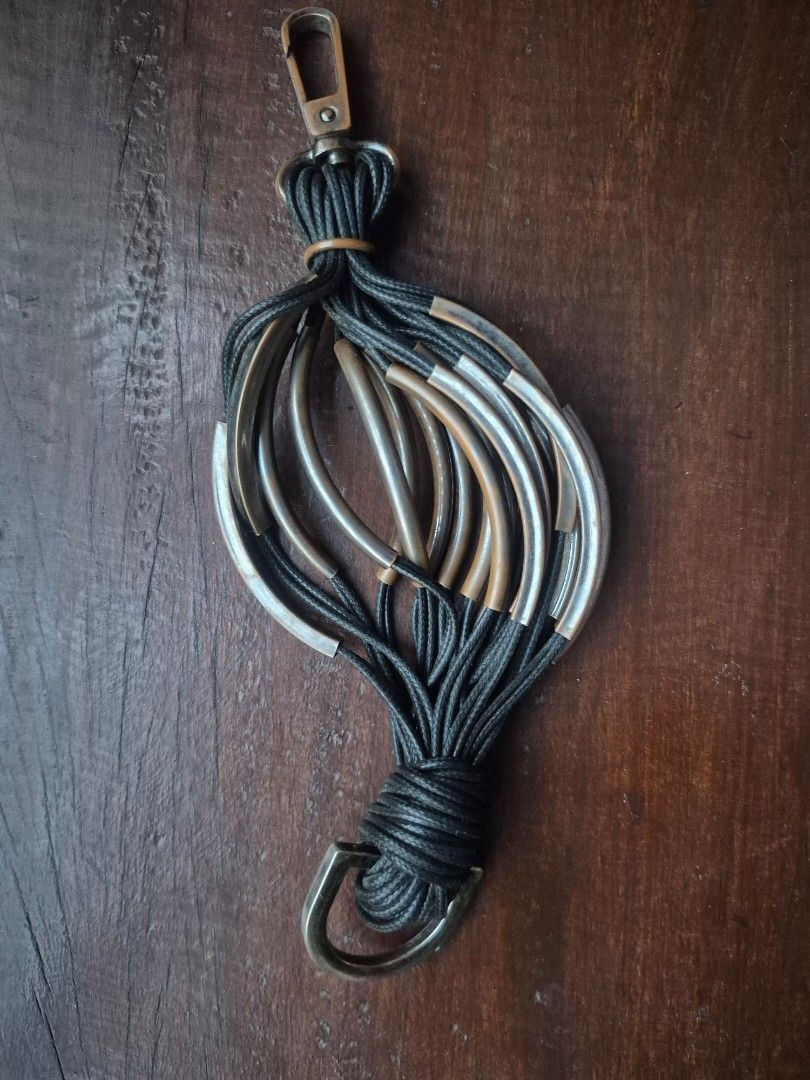 Boho Leather bracelet with Metal Accents (Category: Other Accessories) located in Leyte. Submitted by melinda66885 (Listing ID 1440297700, Image 1). Description: Cool bracelet with a leather tassel and metal tubes. Unique design, great for adding some flair. Measures about 6 inches long..