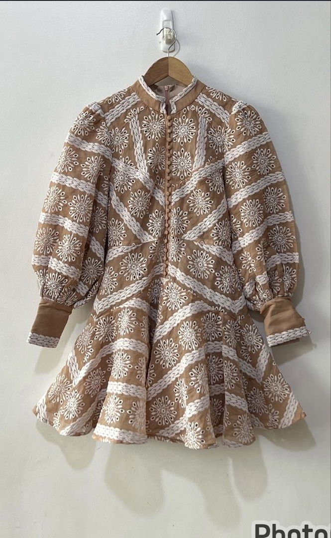 Brown Embroidered Puff Sleeve Mini Dress (Category: Dresses) located in Manila. Submitted by jag888 (Listing ID 1440205087, Image 1). Description: - Elegant mini dress - Brown base with white embroidery - High neckline - Puff sleeves - Flared skirt - Button-up front closure - Perfect for day outs or special occasions.