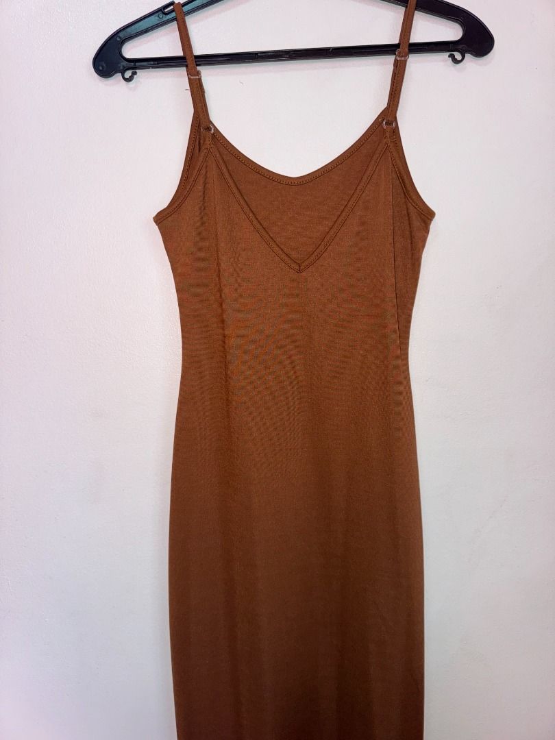Brown Spaghetti Strap Midi Dress with Slit (Category: Dresses) located in Paranaque City. Submitted by renscloset0929 (Listing ID 1440235055, Image 2). Description: - Brown midi dress - High side slit - Perfect for date nights or special occasions.