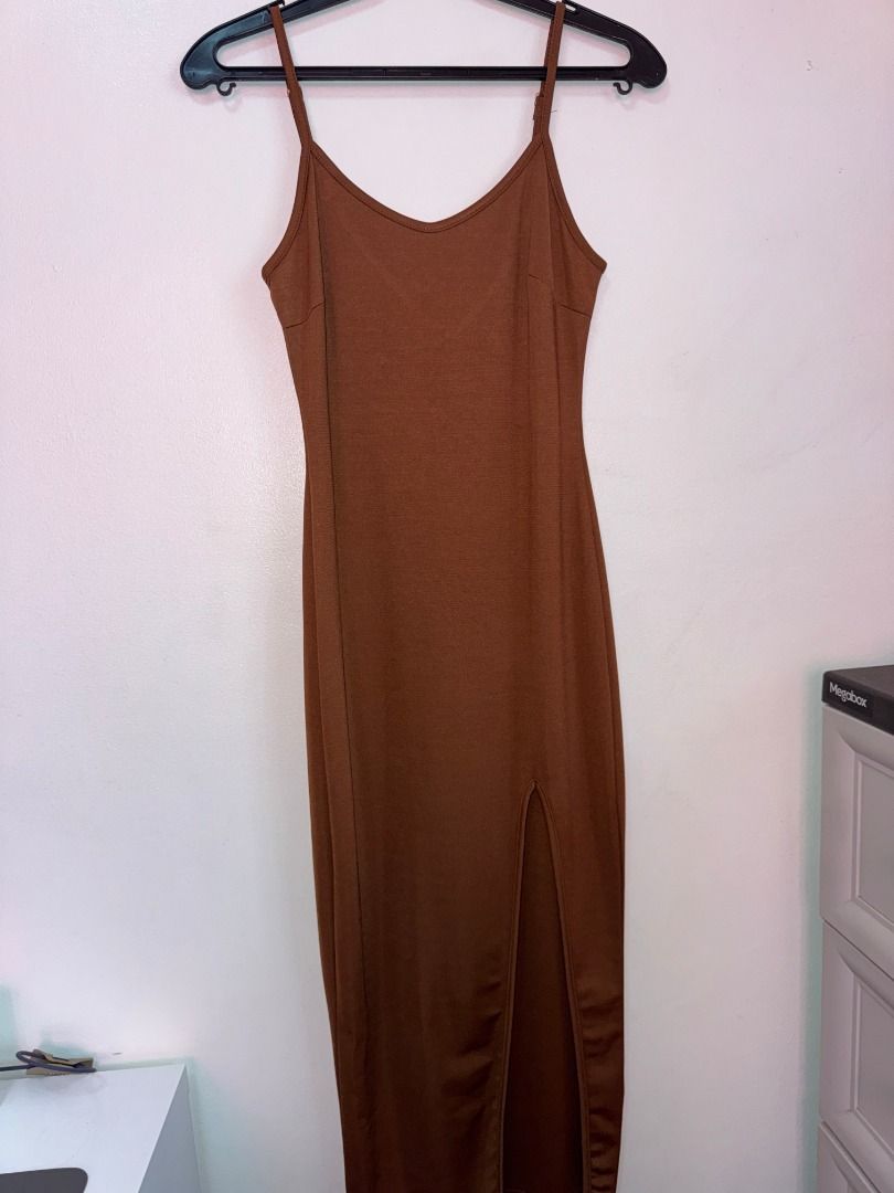 Brown Spaghetti Strap Midi Dress with Slit (Category: Dresses) located in Paranaque City. Submitted by renscloset0929 (Listing ID 1440235055, Image 1). Description: - Brown midi dress - High side slit - Perfect for date nights or special occasions.