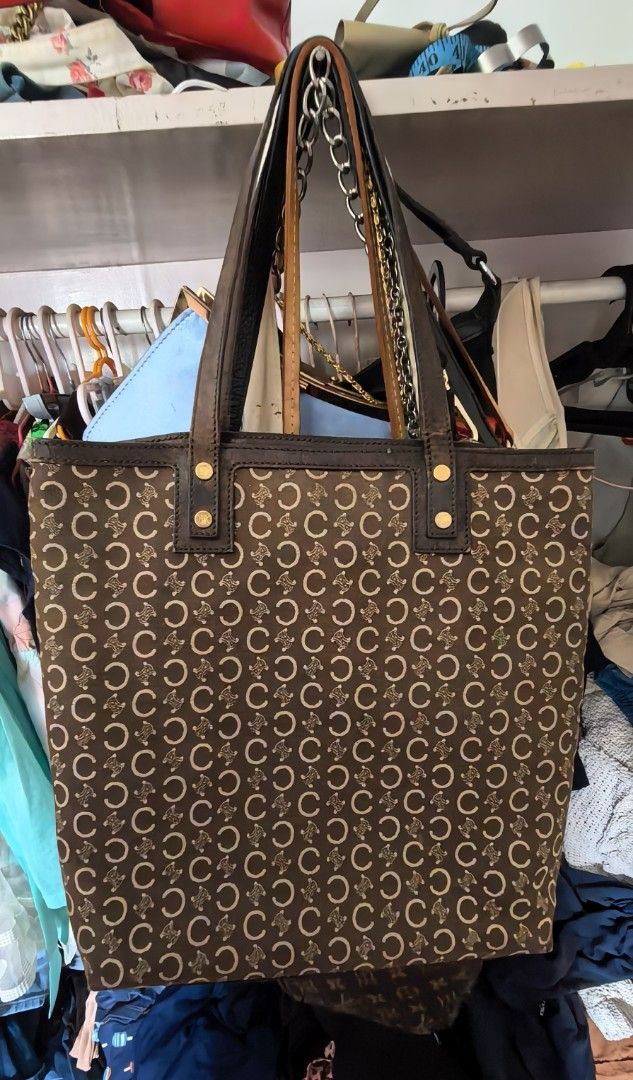 Vintage Celine Monogram Canvas Leather Tote Bag (Category: Luxury Bags & Wallets) located in Cagayan de Oro. Submitted by tommygurl1218 (Listing ID 1440304694, Image 1). Description: - Iconic Celine 'C' monogram brown canvas tote - Genuine leather trim and handles - Interior includes pockets and a zip compartment - Celine logo on zipper pull - Ideal for everyday use - Noteworthy: Some signs of wear on the leather trim.