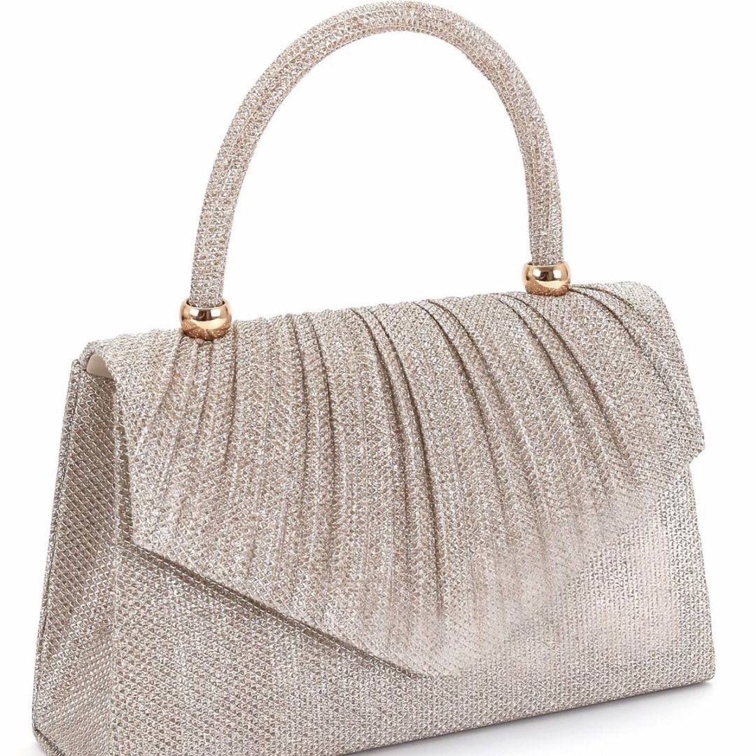 Champagne Classy Sling Bag with Handle (Category: Clutches) located in Tarlac. Submitted by milkshakeee_ (Listing ID 1440276041, Image 1). Description: - Never been used (BRAND NEW) - Bought at tiktok - Champagne sparkly clutch bag - Convenient short handle - Secure magnetic snap closure - Includes a small inner pocket - Ideal for parties, events, and special occasions - Fits essentials like your phone, keys, and lipstick.