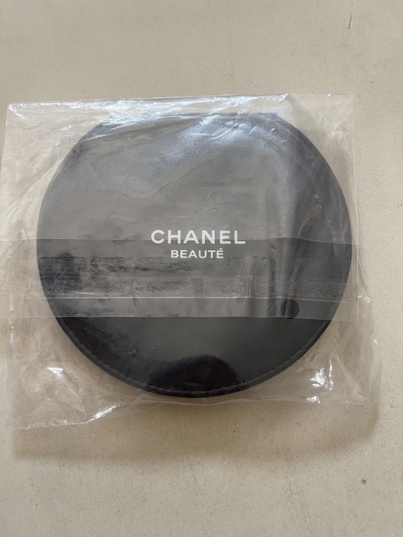 Chanel Beauté Compact Mirror (Category: Mirrors) located in Quezon City. Submitted by kingcurator (Listing ID 1440272582, Image 3). Description: - Authentic Chanel Beauté compact mirror - Black faux leather casing with iconic Chanel logo - Features two mirrors - Comes in original plastic packaging - Ideal for convenient touch-ups anywhere.
