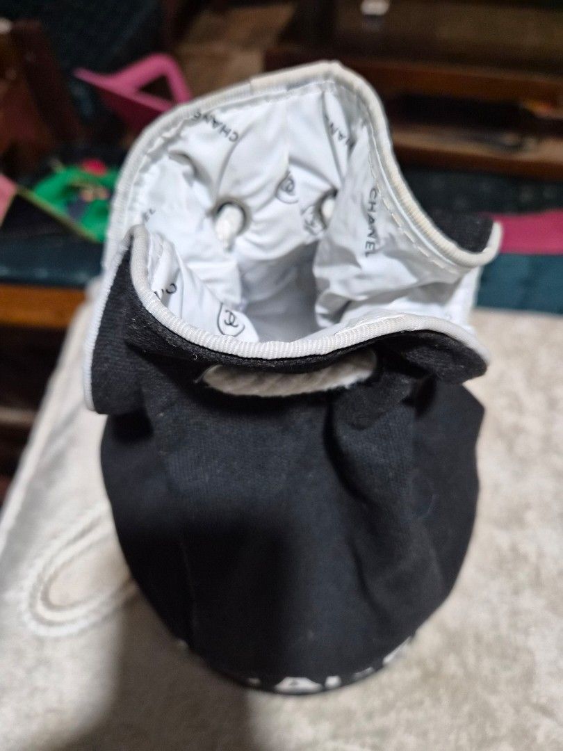 Chanel Black Drawstring Pouch Bucket Bag - Small (Category: Luxury Bags & Wallets) located in Mandaue City. Submitted by chuchi152615 (Listing ID 1440207708, Image 2). Description: - Authentic black Chanel drawstring pouch - Features iconic white Chanel logo on exterior - Interior lining with repeating Chanel logo pattern - Secure white drawstring closure - Perfect for organizing small essentials or as a dust bag for accessories.