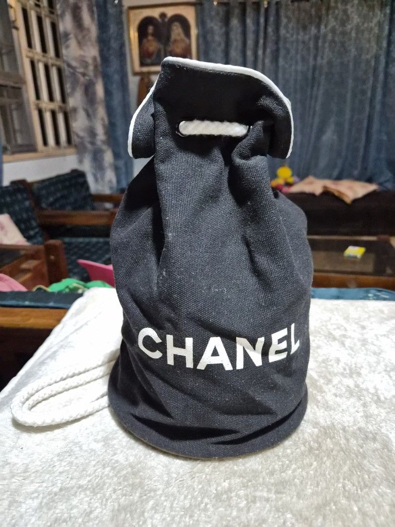 Chanel Black Drawstring Pouch Bucket Bag - Small (Category: Luxury Bags & Wallets) located in Mandaue City. Submitted by chuchi152615 (Listing ID 1440207708, Image 1). Description: - Authentic black Chanel drawstring pouch - Features iconic white Chanel logo on exterior - Interior lining with repeating Chanel logo pattern - Secure white drawstring closure - Perfect for organizing small essentials or as a dust bag for accessories.