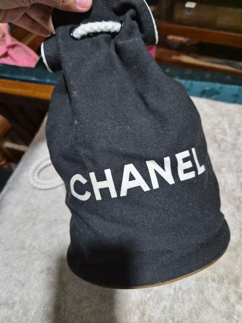 Chanel Black Drawstring Pouch Bucket Bag - Small (Category: Luxury Bags & Wallets) located in Mandaue City. Submitted by chuchi152615 (Listing ID 1440207708, Image 3). Description: - Authentic black Chanel drawstring pouch - Features iconic white Chanel logo on exterior - Interior lining with repeating Chanel logo pattern - Secure white drawstring closure - Perfect for organizing small essentials or as a dust bag for accessories.