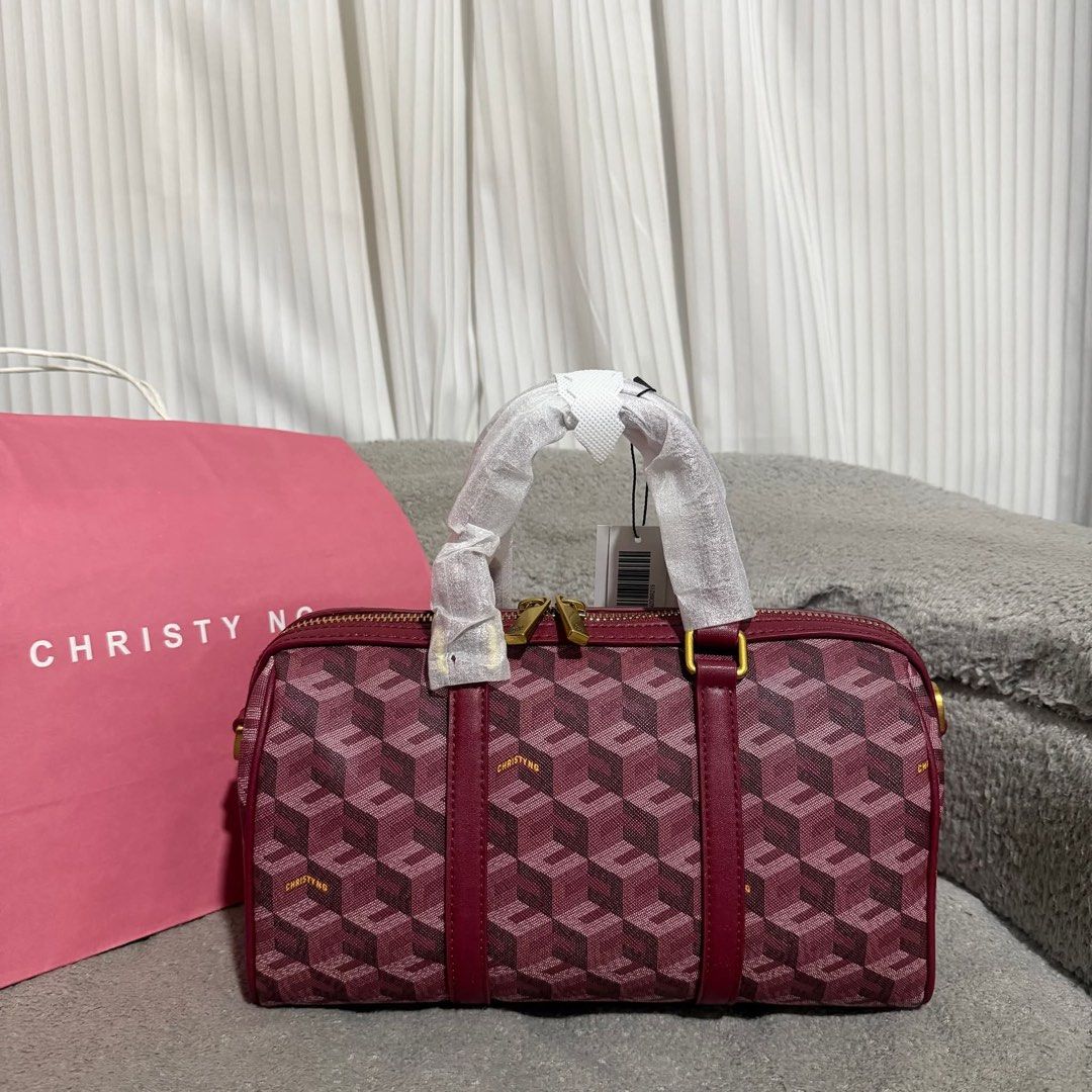 Christy Ng Mini Enzo Burgundy (Category: Luxury Bags & Wallets) located in Guimba. Submitted by brazaschri03660 (Listing ID 1440363502, Image 1). Description: - Brand new Christy Ng monogram boston bag - Stunning deep red/burgundy color - Signature geometric cube pattern - Elegant gold hardware details - Convenient top handles and zip closure - Comes with original dust bag and shopping bag - Never used, with tags still attached.