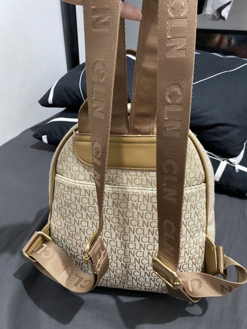 CLN Backpack Beige Monogram with Tan Leather Accents (Category: Backpacks) located in Pasig City. Submitted by blossoms08 (Listing ID 1440365674, Image 2). Description: - Beige backpack with signature CLN monogram pattern - Stylish tan leather trim and pocket details - Convenient front zip pocket and two front flap pockets - Adjustable shoulder straps for a comfortable fit - Elegant gold hardware accents - Ideal for everyday adventures and errand