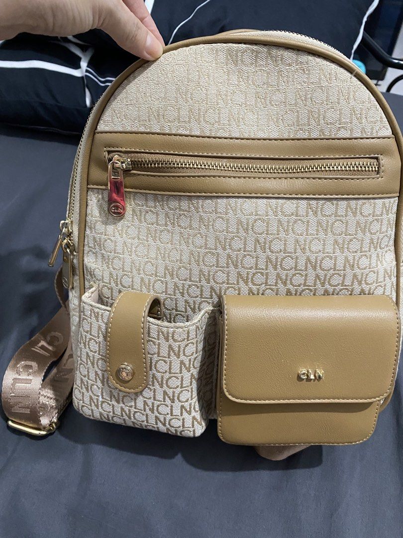 CLN Backpack Beige Monogram with Tan Leather Accents (Category: Backpacks) located in Pasig City. Submitted by blossoms08 (Listing ID 1440365674, Image 1). Description: - Beige backpack with signature CLN monogram pattern - Stylish tan leather trim and pocket details - Convenient front zip pocket and two front flap pockets - Adjustable shoulder straps for a comfortable fit - Elegant gold hardware accents - Ideal for everyday adventures and errand