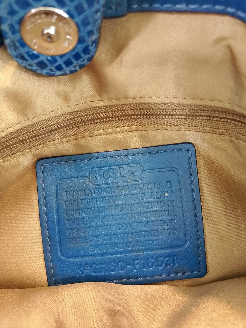 Coach Blue Leather Shoulder Bag with Turnlock Closure (Category: Luxury Bags & Wallets) located in Iloilo. Submitted by janillthrifted (Listing ID 1440205092, Image 2). Description: - Authentic Coach shoulder bag - Vibrant blue leather - Signature turnlock closure - Textured accents on front strap - Light-colored fabric interior - Interior zippered pocket - Made in Vietnam - Stylish and practical for everyday use.