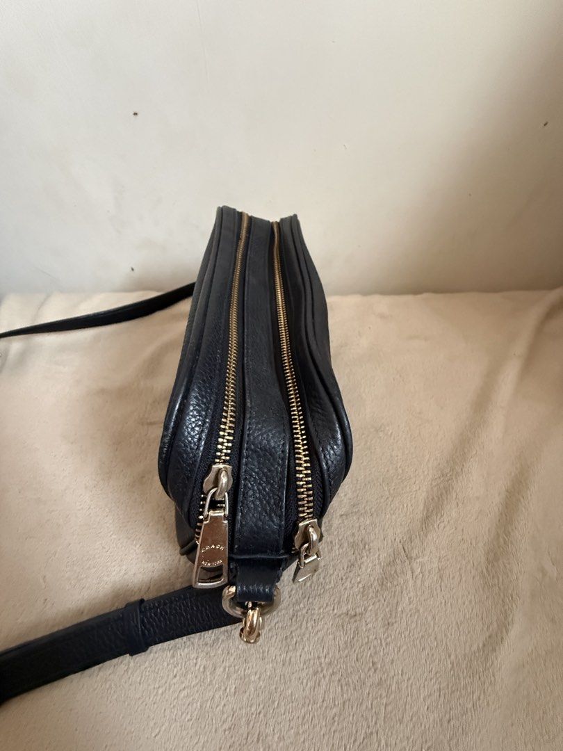 Coach Pebble Leather Crossbody Bag Black (Category: Cross-body Bags) located in Pasig City. Submitted by sellingitlow (Listing ID 1440241625, Image 3). Description: - Brand: Coach - Material: Black pebbled leather - Style: Crossbody bag - Features: Two zippered compartments, gold hardware details, adjustable shoulder strap - Model Number: M1877-F39856 - Ideal for: Everyday use -Fits long wallet and all outfits. -Classy look.