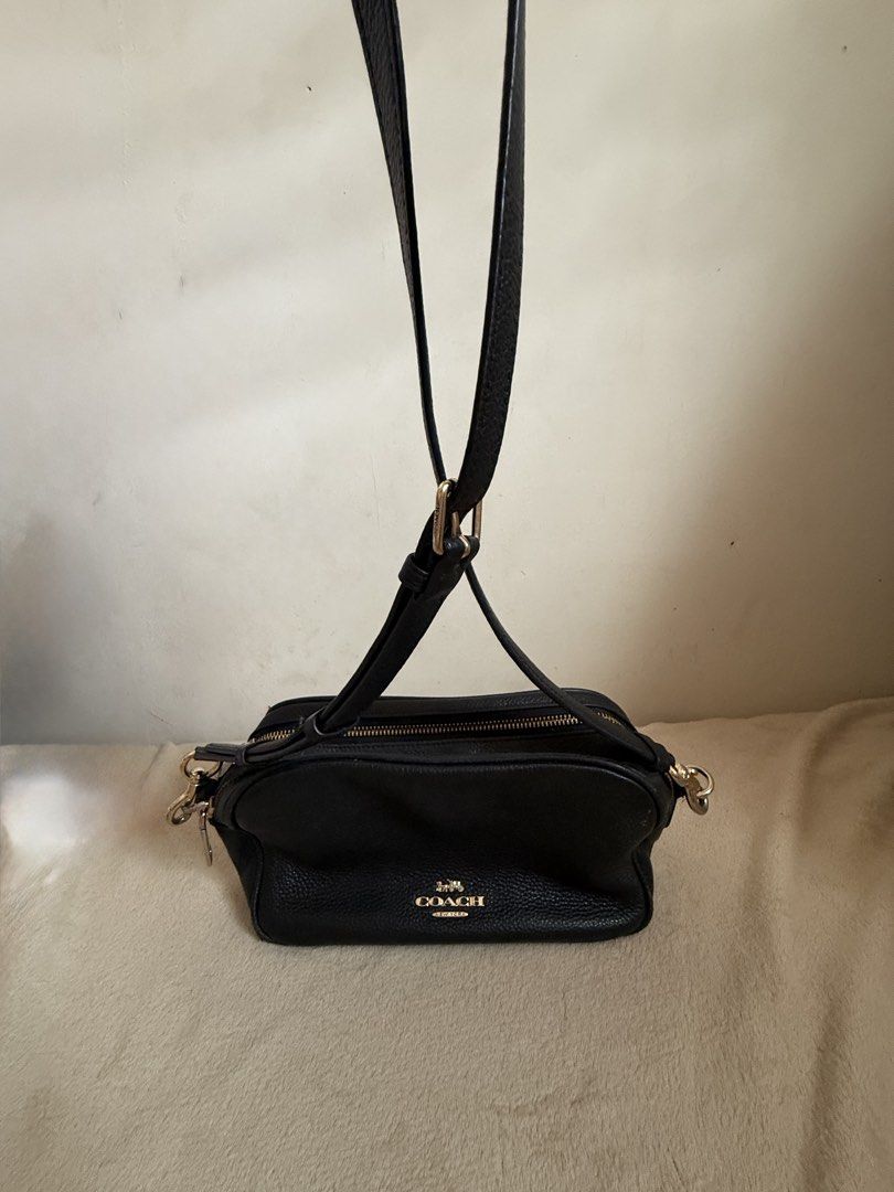 Coach Pebble Leather Crossbody Bag Black (Category: Cross-body Bags) located in Pasig City. Submitted by sellingitlow (Listing ID 1440241625, Image 2). Description: - Brand: Coach - Material: Black pebbled leather - Style: Crossbody bag - Features: Two zippered compartments, gold hardware details, adjustable shoulder strap - Model Number: M1877-F39856 - Ideal for: Everyday use -Fits long wallet and all outfits. -Classy look.