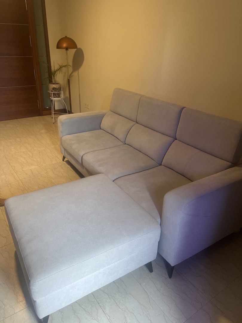 Comfortable Light Grey Fabric Sofa (Category: Sofas) located in Singapore. Submitted by shankarve90647 (Listing ID 1440299926, Image 2). Description: - Comfortable light grey fabric sofa very light use - Bought September 2025, selling due to relocation outside Singapore - Plush cushions for extra comfort - Adjustable headrests for personalized support - Soft-touch fabric - Ideal for lounging and entertaining - Fits most living room spaces - Easy 