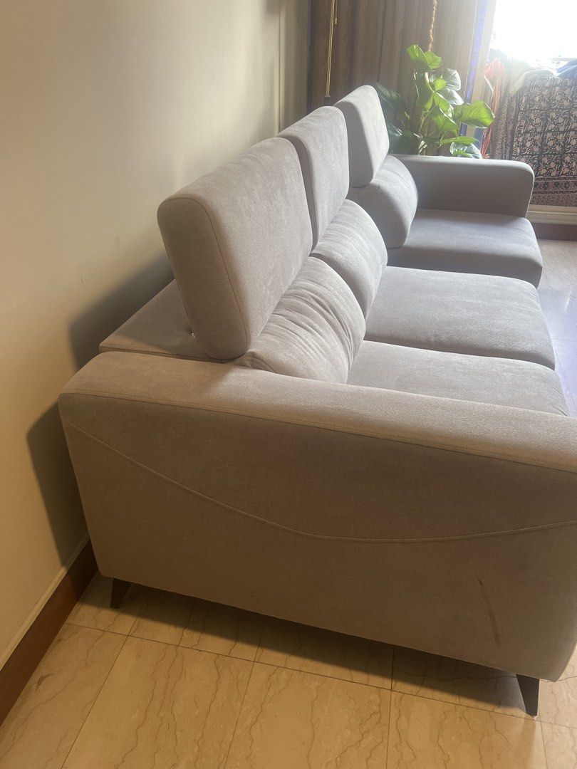 Comfortable Light Grey Fabric Sofa (Category: Sofas) located in Singapore. Submitted by shankarve90647 (Listing ID 1440299926, Image 3). Description: - Comfortable light grey fabric sofa very light use - Bought September 2025, selling due to relocation outside Singapore - Plush cushions for extra comfort - Adjustable headrests for personalized support - Soft-touch fabric - Ideal for lounging and entertaining - Fits most living room spaces - Easy 