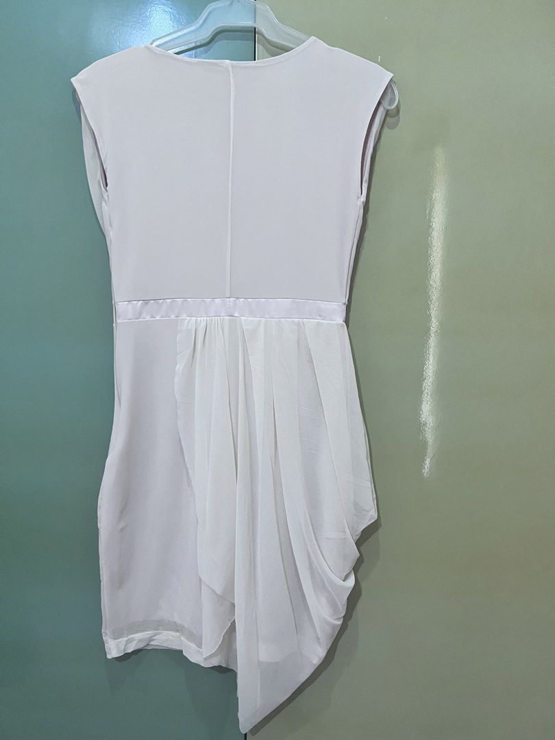 Cream Draped Asymmetrical Dress (Category: Dresses) located in Cainta. Submitted by gigifern.653 (Listing ID 1440200881, Image 3). Description: - Elegant cream dress - Flattering draped asymmetrical hemline - Chic satin waistband - Classic cap sleeves and round neckline - Perfect for special occasions or evening wear - Easy side zipper closure - Brand is Studio (purchased from SM Makati).