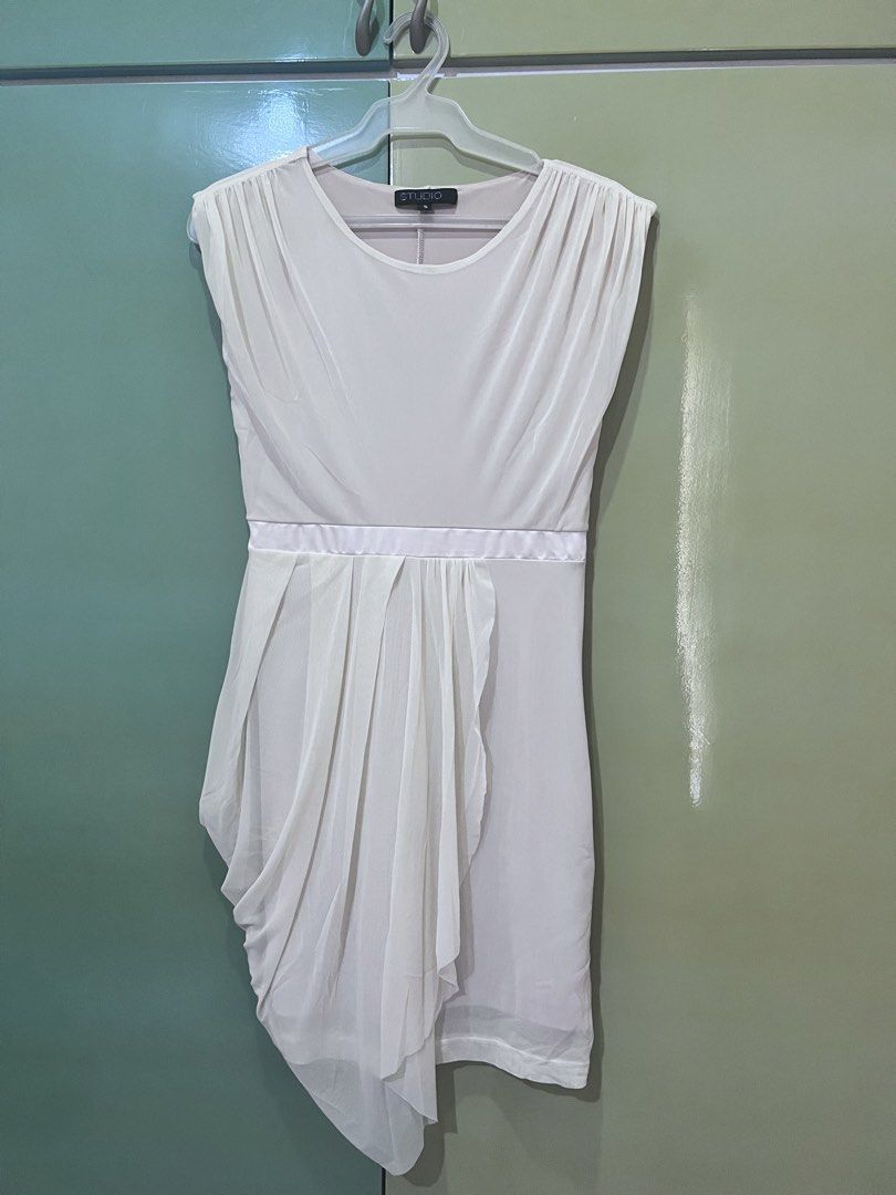 Cream Draped Asymmetrical Dress (Category: Dresses) located in Cainta. Submitted by gigifern.653 (Listing ID 1440200881, Image 1). Description: - Elegant cream dress - Flattering draped asymmetrical hemline - Chic satin waistband - Classic cap sleeves and round neckline - Perfect for special occasions or evening wear - Easy side zipper closure - Brand is Studio (purchased from SM Makati).