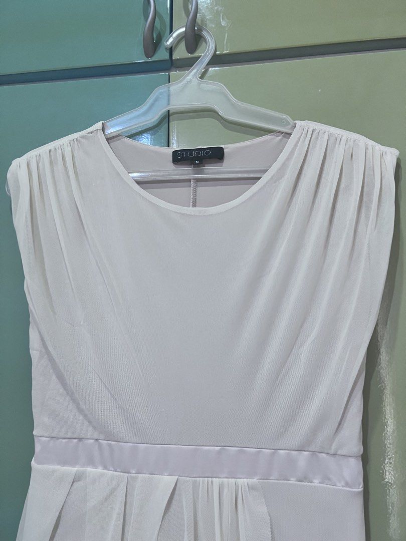 Cream Draped Asymmetrical Dress (Category: Dresses) located in Cainta. Submitted by gigifern.653 (Listing ID 1440200881, Image 2). Description: - Elegant cream dress - Flattering draped asymmetrical hemline - Chic satin waistband - Classic cap sleeves and round neckline - Perfect for special occasions or evening wear - Easy side zipper closure - Brand is Studio (purchased from SM Makati).