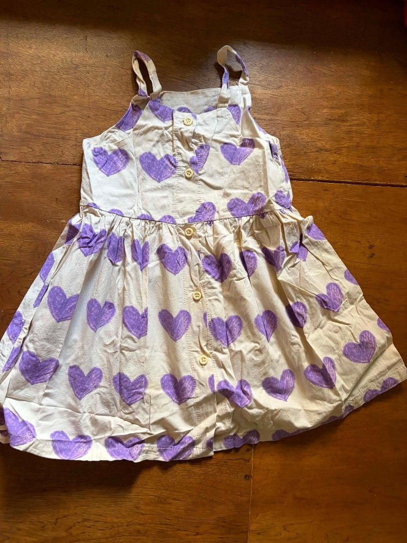 Cute Purple Heart Print Kids Dress (Category: Babies & Kids Fashion) located in Las Pinas. Submitted by pinkpototo36548 (Listing ID 1440265141, Image 2). Description: - Adorable cream-colored dress - Features a fun all-over purple heart print - Easy button-up front for dressing - Perfect for casual outings or parties - Stylish and comfy for everyday wear 💵 - via gcash or bpi 🚚📦 - via jnt or gogo express.