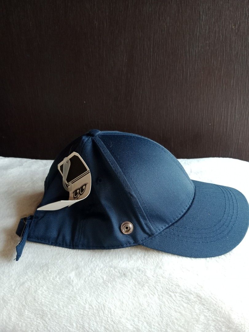 Dark Blue Cap with Metal Accents (Category: Caps & Hats) located in Manila. Submitted by angeloarce64172 (Listing ID 1440230896, Image 2). Description: - Dark blue baseball cap - Features cool metal details on the side and back - Adjustable strap for a perfect fit - Brand new with tags still attached - Ideal for casual outings or sports activities.